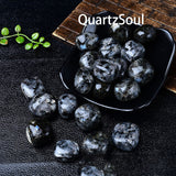 Natural Black Tourmaline tumbled stones with white streaks in decorative bowl