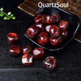 Premium quality bloodstone tumbled crystals displayed in black bowl showcasing vibrant colors
