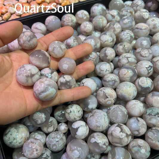 Bulk collection of Blossom Agate crystal spheres for wholesale crystal suppliers and retailers