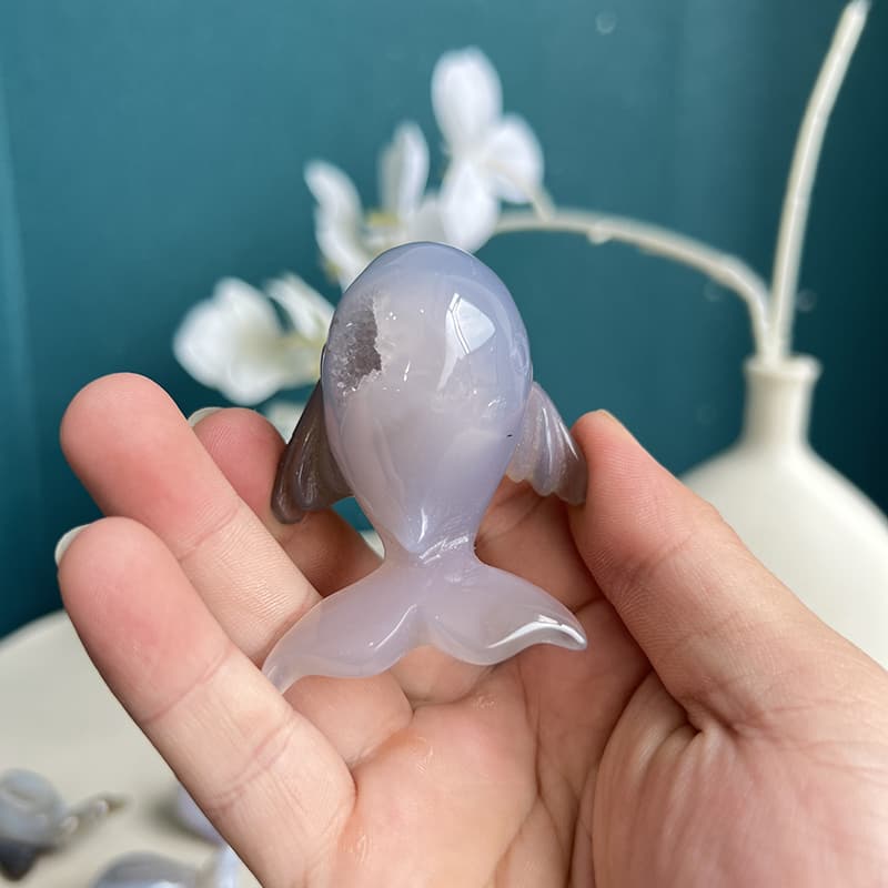 Serene meditation space featuring dolphin agate crystal carving on altar