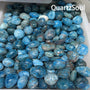 Premium wholesale Apatite tumbled stones with vibrant blue coloration for crystal retailers