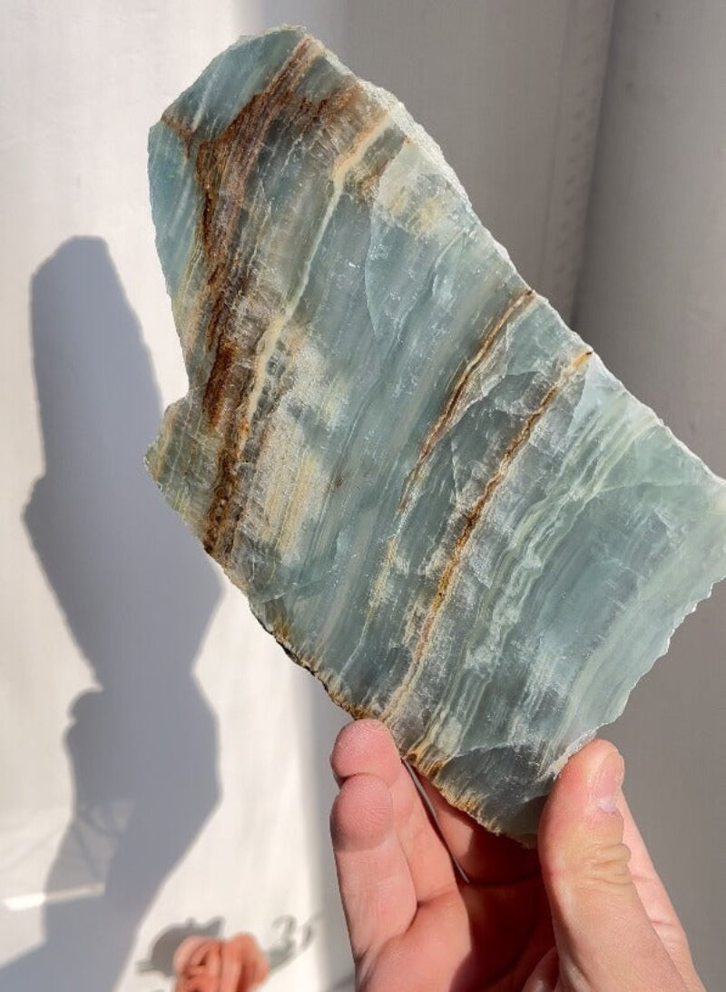 Blue onyx slabs in retail display arrangement