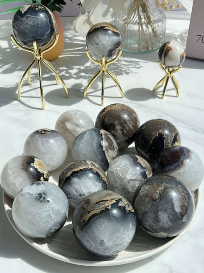 Blue Volcanic Agate Crystal Sphere on Display Stand