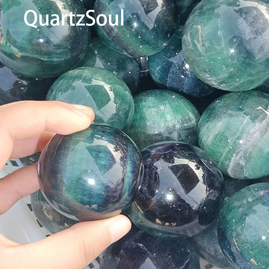 Collection of wholesale fluorite crystal spheres with varied green patterns