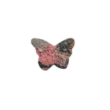 Color variations in rhodonite butterfly carving from soft pink to deeper rose tones