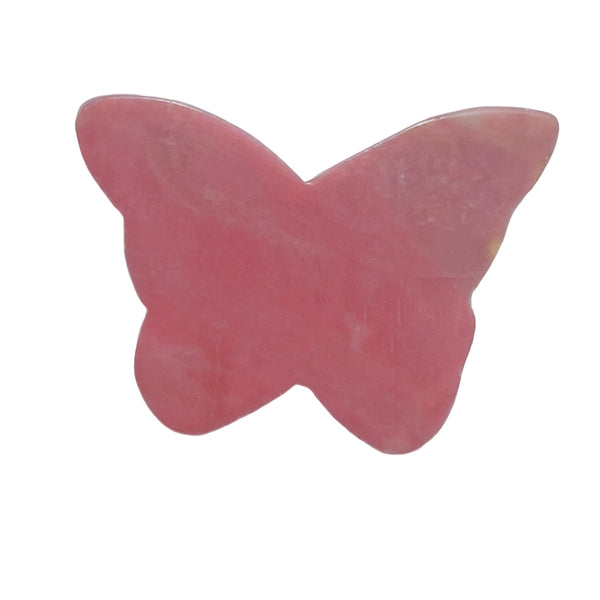 Pink rhodonite butterfly crystal carving in meditation altar setup for emotional healing