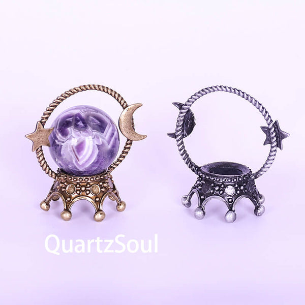 Celestial crystal ball stand with moon and star design in gold and silver finishes for crystal sphere display