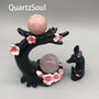 Handcrafted cherry blossom crystal ball stand featuring dual sphere holders and floral accents