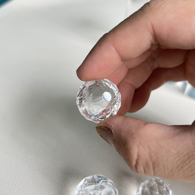  Premium Clear Quartz crystal sphere carving with faceted surface catching light