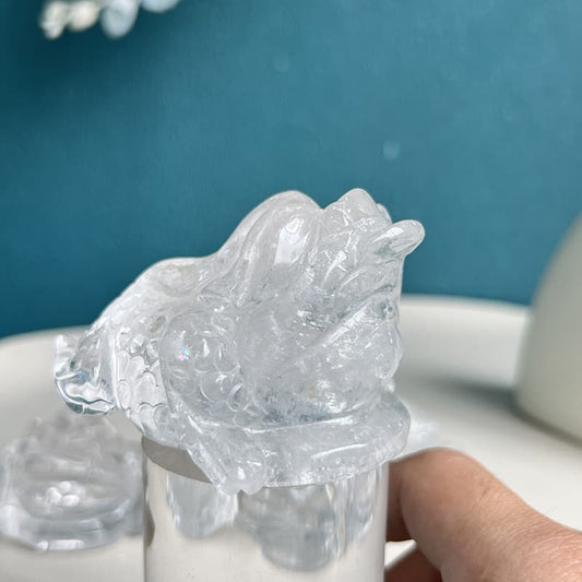 Clear quartz golden toad crystal carving symbolizing prosperity and abundance