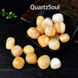 Premium Cream Yellow Jade tumbled stones arranged in black display dish