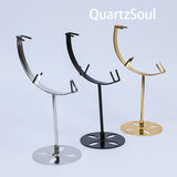 Collection of crystal display stands in silver, black and gold finishes for showcasing spheres and minerals