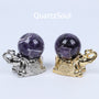 Amethyst Crystal Spheres on Elephant Display Stands in Silver and Gold