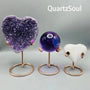 Crystal love bracket stands displaying amethyst heart, purple sphere and selenite heart