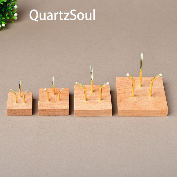 Four sizes of wooden crystal display stands with three-claw design for showcasing mineral specimens