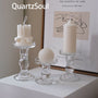 Set of three crystal glass candle holders displaying different types of candles elegant home decor