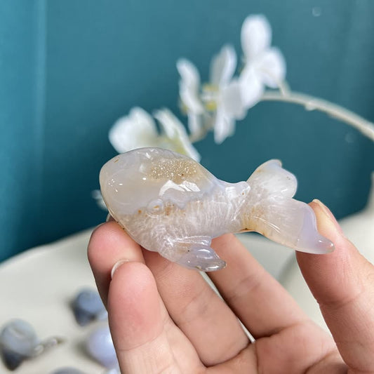 Elegant hand-carved dolphin agate crystal sculpture with natural striations
