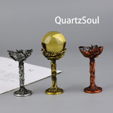 Elegant dragon crystal ball stands in silver, gold, and rose gold finishes for displaying crystal spheres and mineral specimens