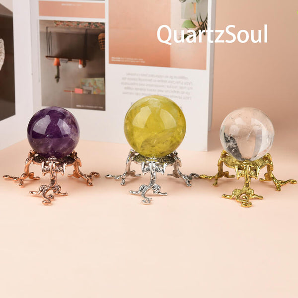  Elegant crystal ball stands in rose gold, silver and gold finishes displaying amethyst, citrine and clear quartz spheres