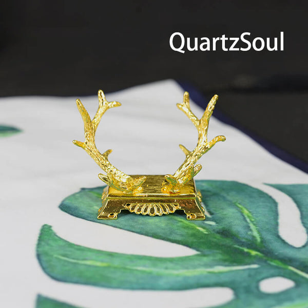 Gold antler crystal ball stand holder displaying elegant design for spheres