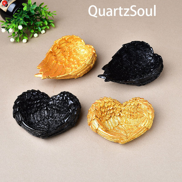 Elegant heart-shaped crystal ball display stand in black finish for spheres and minerals