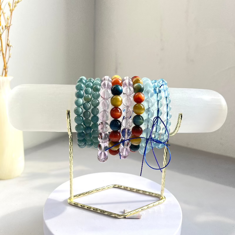 Elegant metal display stand for crystal spheres and minerals in gold finish