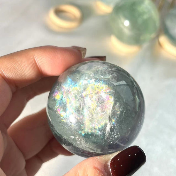 Various sizes of light green fluorite crystal spheres