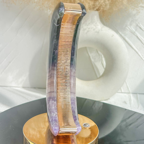 Purple fluorite crystal lamp illuminated in dark room
