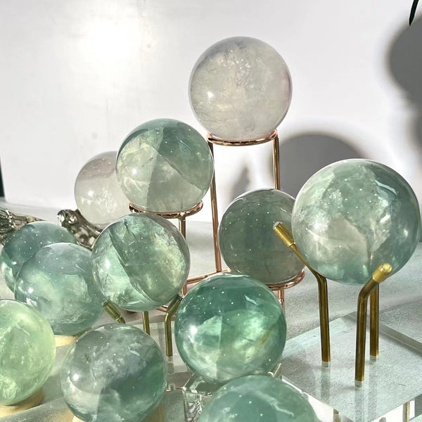 Light green fluorite sphere in meditation space arrangement