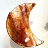 Golden Healer Moon Crystal used in meditation setting with soft lighting