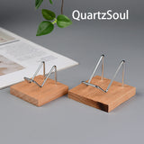 Handcrafted wooden crystal display stand with silver metal holder detail view
