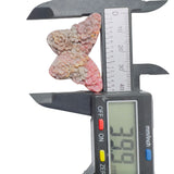 Rhodonite butterfly crystal displayed to show energy flow and healing properties