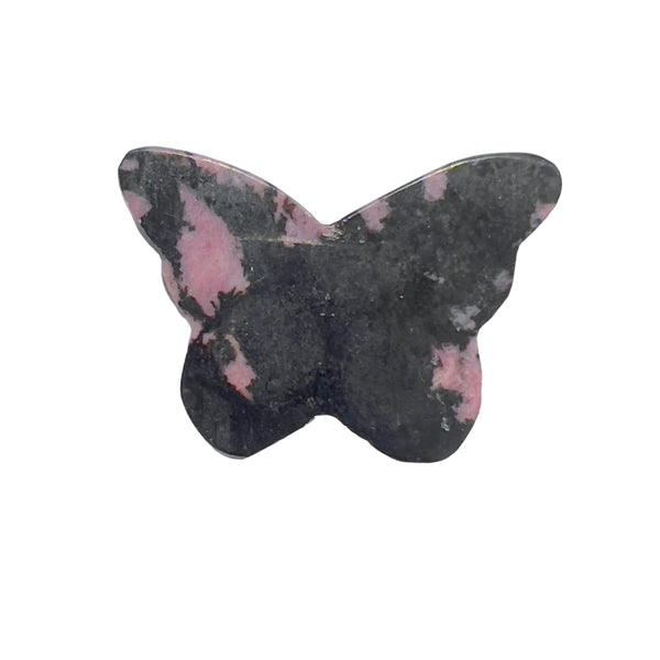 Close-up detail of rhodonite butterfly carving showing intricate pink and black patterns