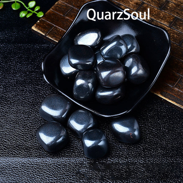 Premium Hematite tumbled gemstones displayed in black bowl showing metallic sheen