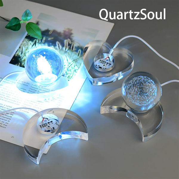 Acrylic crystal ball display stand with blue LED illumination showcasing crystal spheres