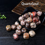 Premium Leopardskin Jasper Polished Tumbled Stones Displayed in Black Bowl
