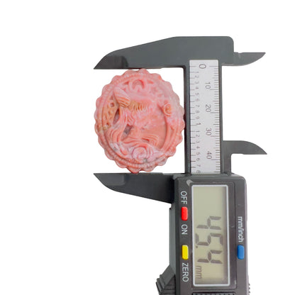 Reverse side of rhodonite magical girl carved crystal