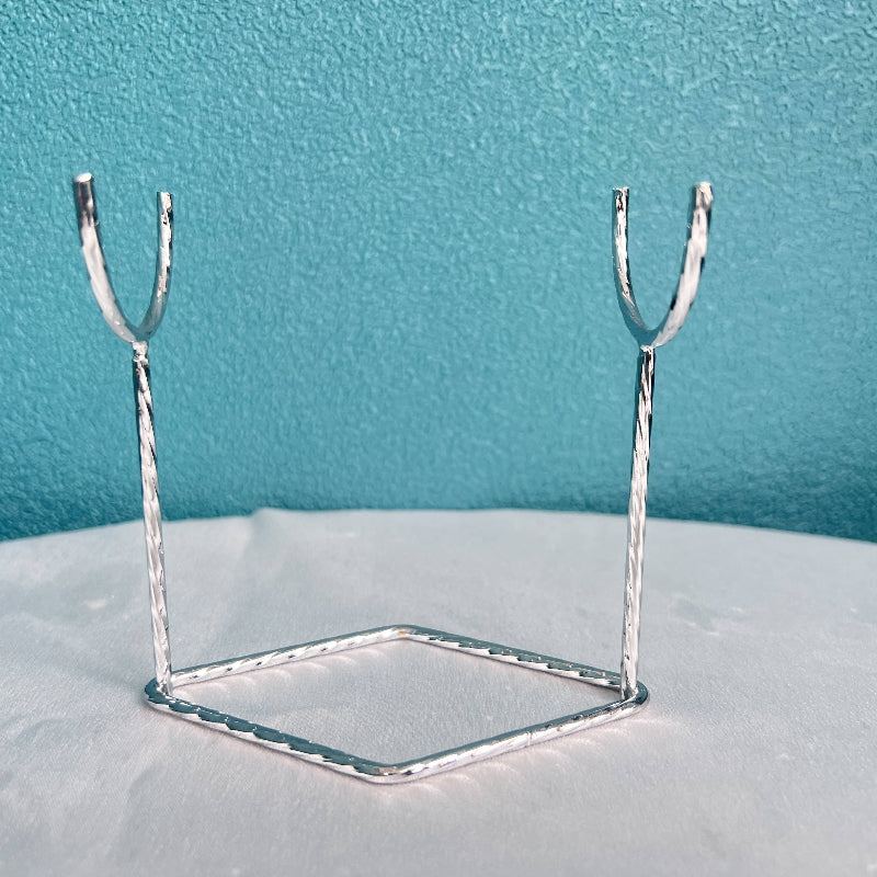 Metal display stand showcasing crystal sphere collection