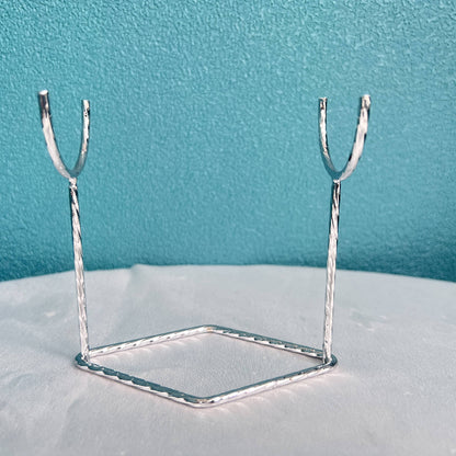 Metal display stand showcasing crystal sphere collection
