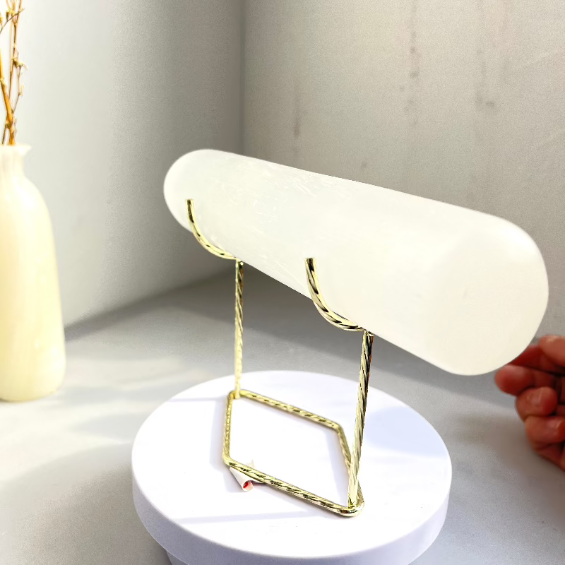 Metal stand showcasing precious mineral specimens