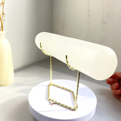 Metal stand showcasing precious mineral specimens
