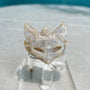 Moonstone fox carving displayed on crystal stand showing shimmer effect