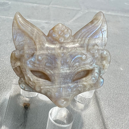 Close-up detail of moonstone fox carving facial features