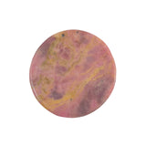 Close-up of natural rhodonite bear carving texture and patterns