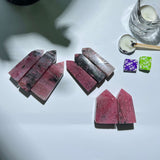 Collection of natural Rhodonite Tower crystals available for wholesale purchase