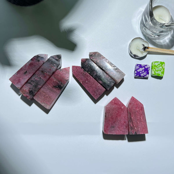 Collection of natural Rhodonite Tower crystals available for wholesale purchase