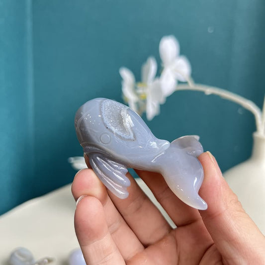 Handcrafted natural whale agate crystal carving with unique healing properties