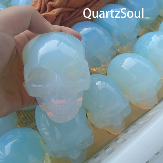Wholesale opal crystal skull with opalescent blue glow for crystal retailers