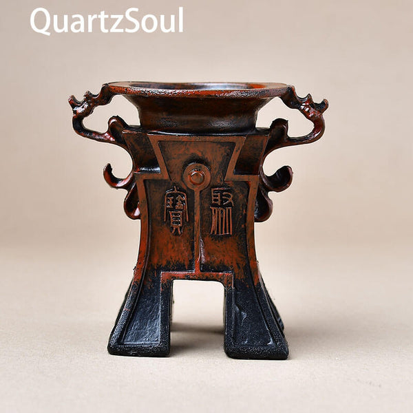 Handcrafted crystal display stand with ornate details for spheres and minerals