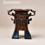 Handcrafted crystal display stand with ornate details for spheres and minerals